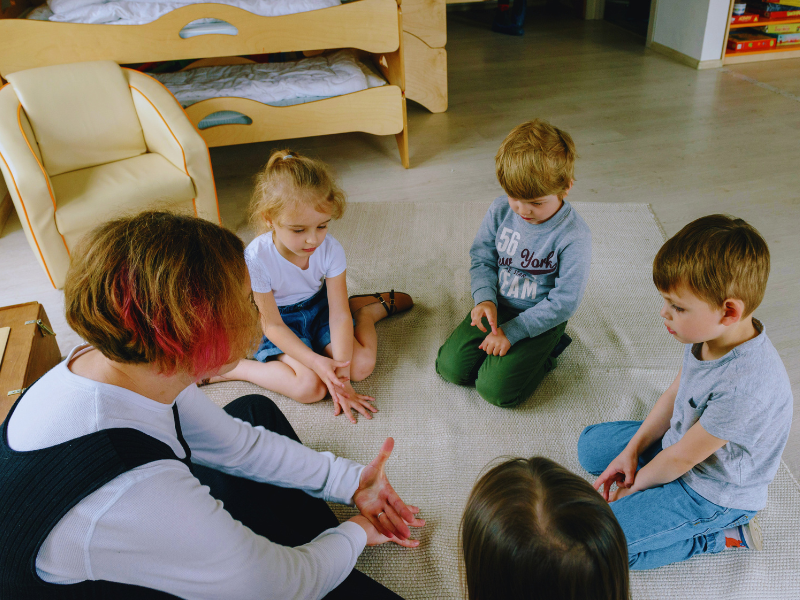 Teacher with her children students