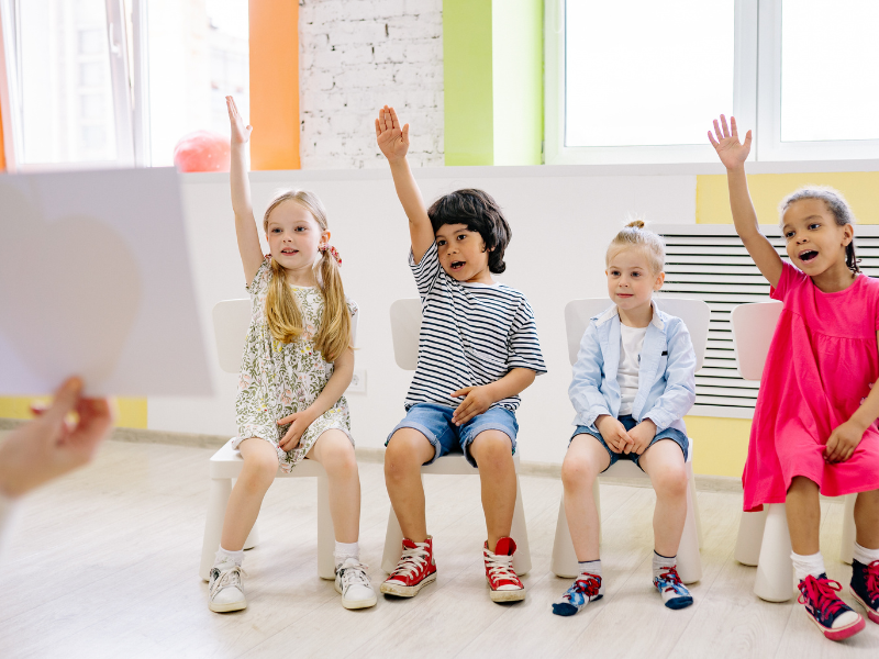Kids raising hands